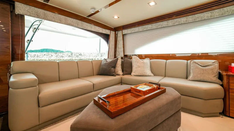 Free Spool Yacht Photos Pics Luxurious interior of 2023 Viking 72 yacht with plush seating and elegant decor.