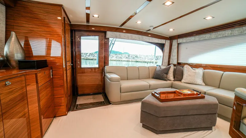 Free Spool Yacht Photos Pics Luxurious interior of 2023 Viking 72 yacht with elegant seating and wooden finishes.