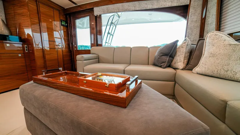 Free Spool Yacht Photos Pics Luxurious interior of 2023 Viking 72 yacht with elegant seating and wooden accents.