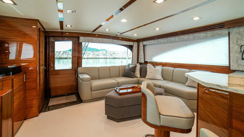 Free Spool Yacht Photos Pics Luxurious interior of 2023 Viking 72 yacht with elegant seating and modern design.