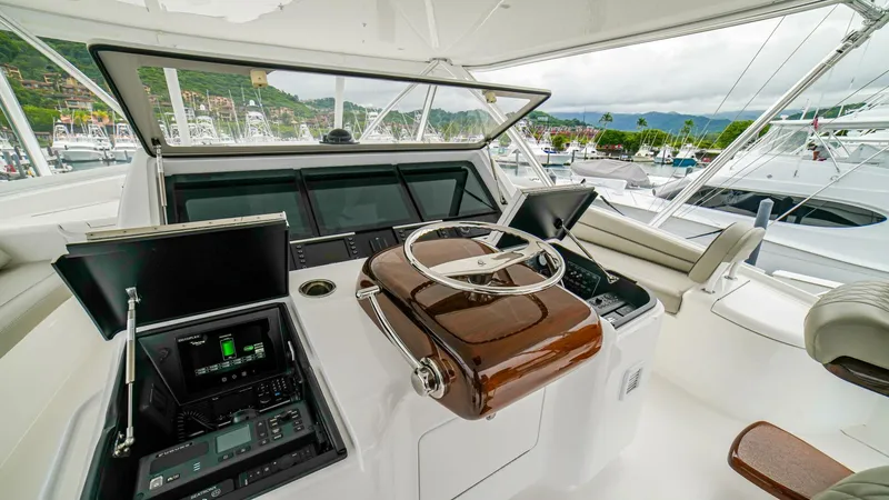Free Spool Yacht Photos Pics Cockpit of 2023 Viking 72 yacht with modern navigation equipment and steering wheel.