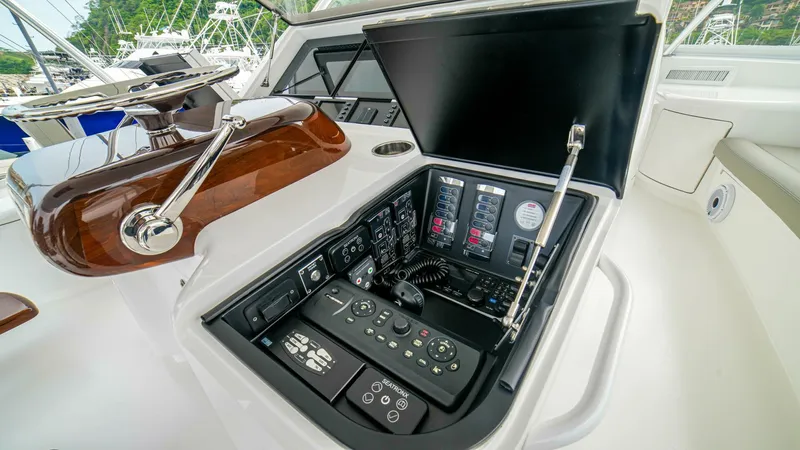 Free Spool Yacht Photos Pics 2023 Viking 72 yacht control panel with advanced navigation and communication systems.