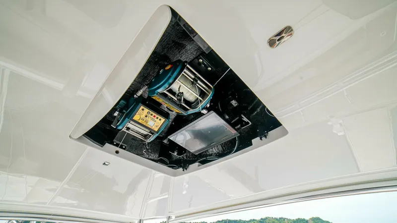Free Spool Yacht Photos Pics 2023 Viking 72 yacht ceiling panel with exposed electrical components and wiring.