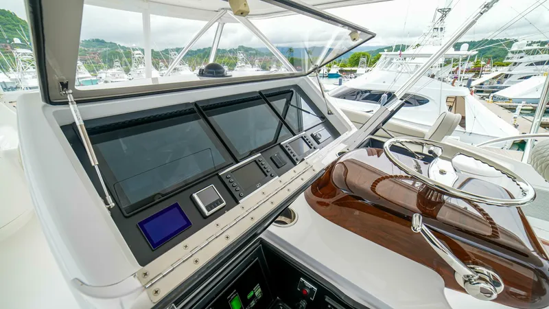 Free Spool Yacht Photos Pics Control panel of 2023 Viking 72 yacht with modern navigation equipment.
