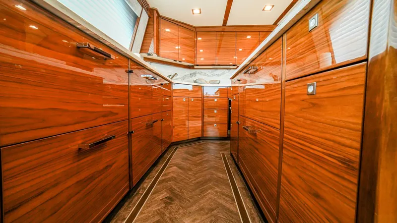 Free Spool Yacht Photos Pics Luxurious wooden interior of 2023 Viking 72 yacht kitchen.