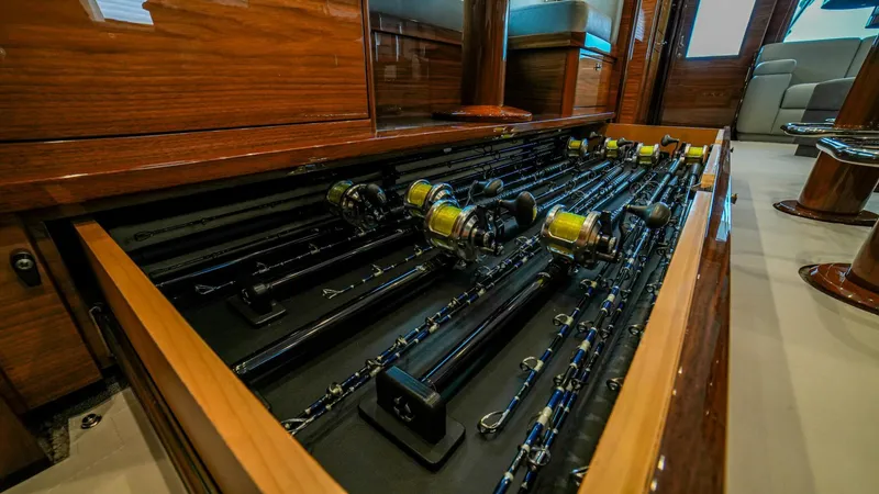 Free Spool Yacht Photos Pics Fishing rods neatly stored in a drawer on a 2023 Viking 72 yacht.