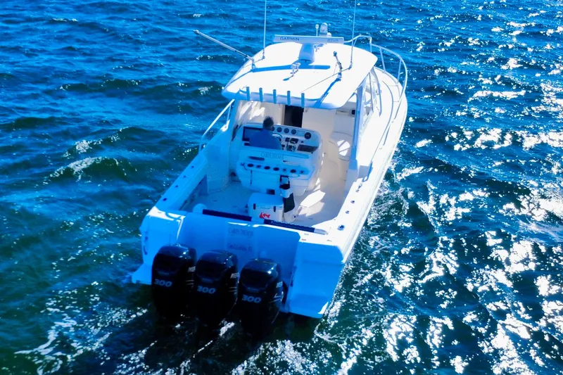  Yacht Photos Pics 2000 Intrepid 377 Walkaround boat cruising on open water with triple engines.