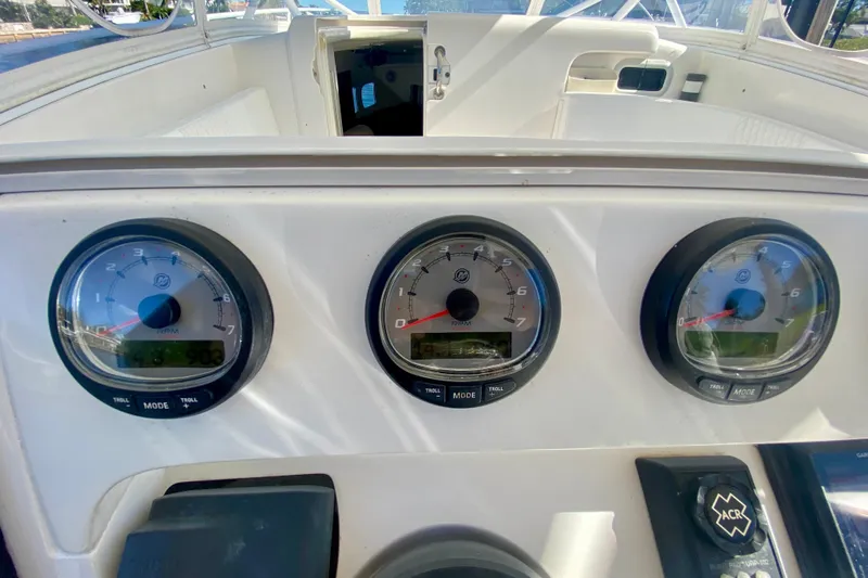  Yacht Photos Pics Dashboard of a 2000 Intrepid 377 Walkaround boat with three RPM gauges.