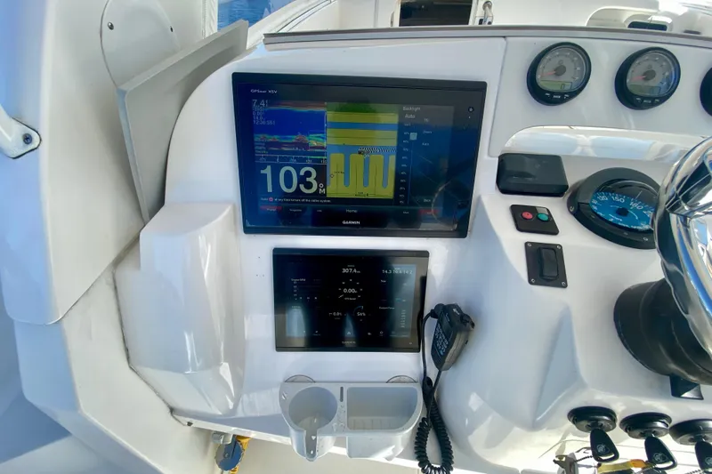  Yacht Photos Pics Control panel of a 2000 Intrepid 377 Walkaround boat with navigation screens and gauges.
