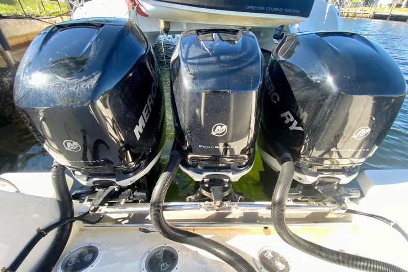  Yacht Photos Pics Triple Mercury outboard engines on a 2000 Intrepid 377 Walkaround boat.