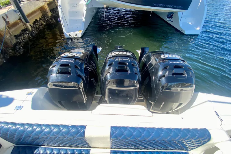  Yacht Photos Pics Triple outboard engines on a 2000 Intrepid 377 Walkaround boat in Miami marina.