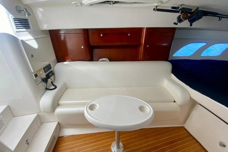  Yacht Photos Pics Interior of 2000 Intrepid 377 Walkaround with seating and table.