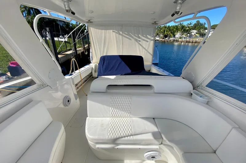  Yacht Photos Pics 2000 Intrepid 377 Walkaround boat interior with white seating and waterfront view.