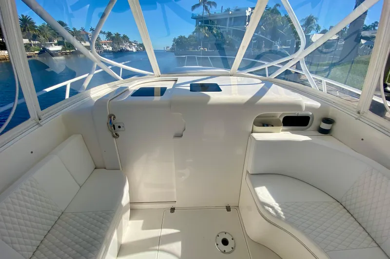  Yacht Photos Pics 2000 Intrepid 377 Walkaround boat interior with white seating and waterfront view.