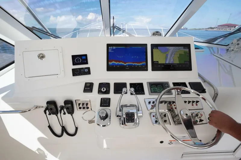 True Story Yacht Photos Pics Helm of 2012 Cabo 40 Hardtop Express with navigation screens and controls.