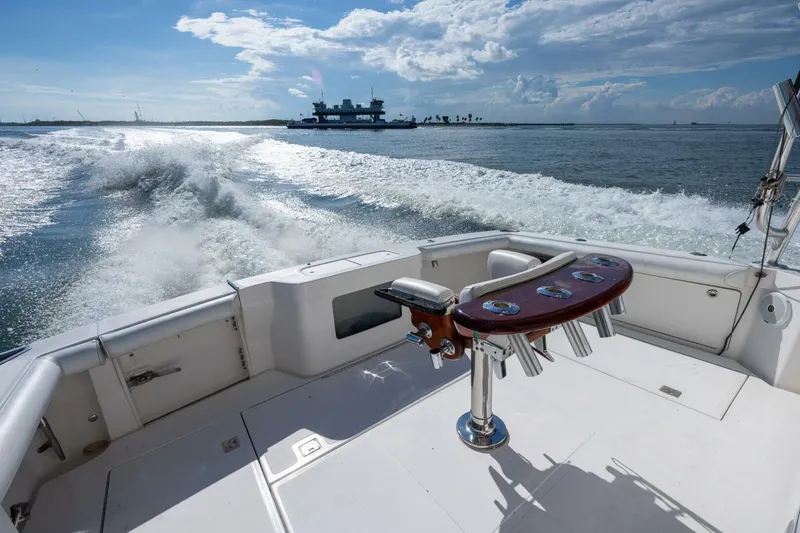 True Story Yacht Photos Pics 2012 Cabo 40 Hardtop Express cruising on open water, leaving a wake behind.