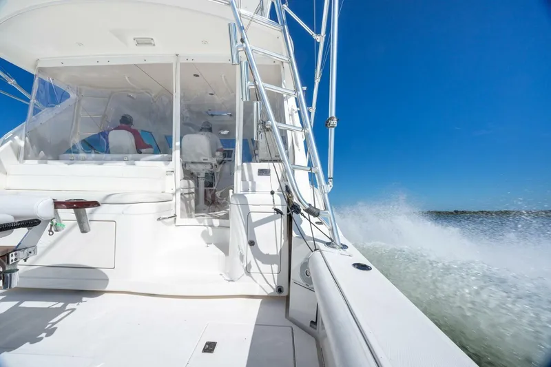 True Story Yacht Photos Pics 2012 Cabo 40 Hardtop Express yacht cruising on open water under clear blue sky.