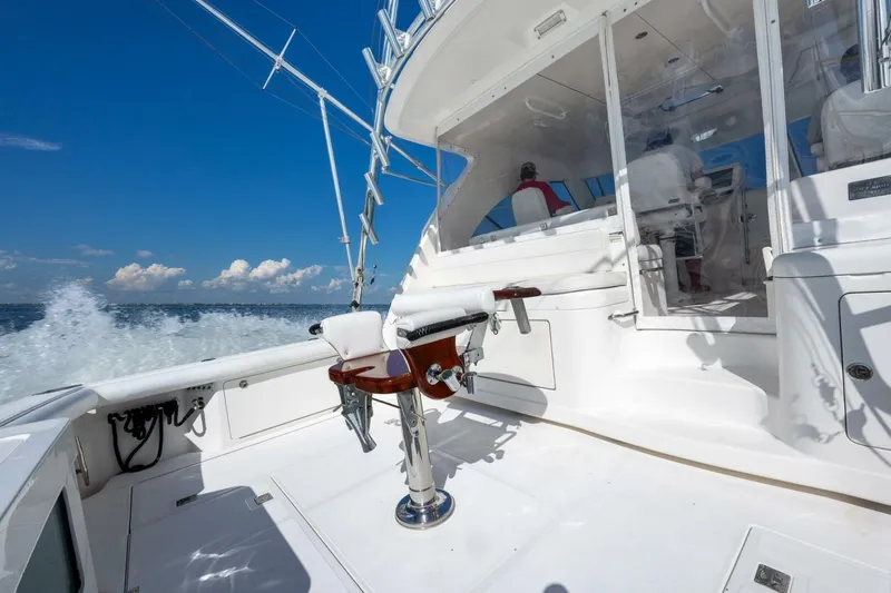 True Story Yacht Photos Pics 2012 Cabo 40 Hardtop Express yacht cruising on open water, featuring a sleek white deck.