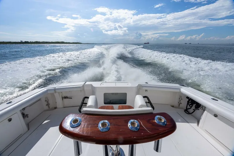 True Story Yacht Photos Pics 2012 Cabo 40 Hardtop Express cruising on open water, leaving a wake behind.