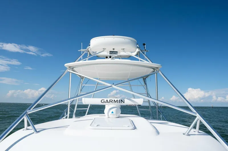 True Story Yacht Photos Pics 2012 Cabo 40 Hardtop Express boat with Garmin equipment against a clear blue sky.