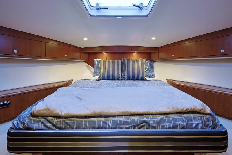 True Story Yacht Photos Pics Luxurious cabin interior of 2012 Cabo 40 Hardtop Express yacht with cozy bedding.