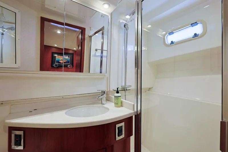 True Story Yacht Photos Pics Luxurious bathroom in 2012 Cabo 40 Hardtop Express yacht with modern fixtures and shower.