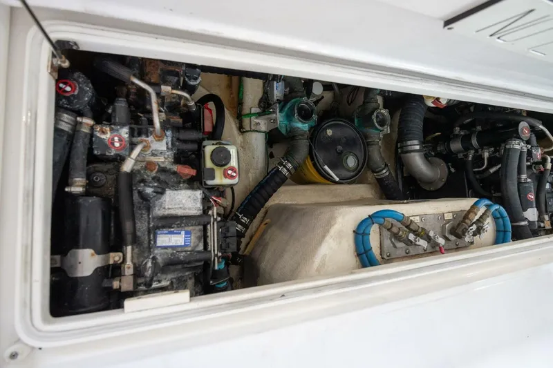 True Story Yacht Photos Pics Engine compartment of 2012 Cabo 40 Hardtop Express with visible mechanical components.