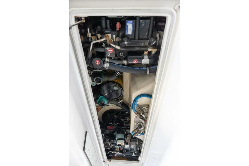 True Story Yacht Photos Pics Engine compartment of a 2012 Cabo 40 Hardtop Express boat, showcasing mechanical components.