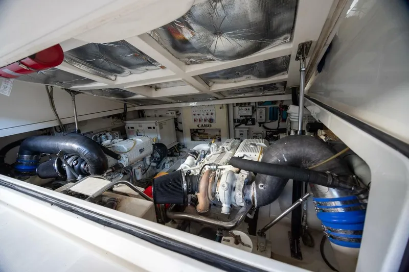 True Story Yacht Photos Pics Engine room of 2012 Cabo 40 Hardtop Express boat, showcasing mechanical components.