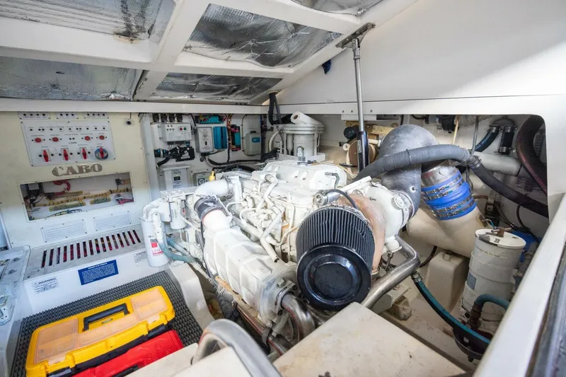 True Story Yacht Photos Pics Engine room of 2012 Cabo 40 Hardtop Express, showcasing machinery and control panels.