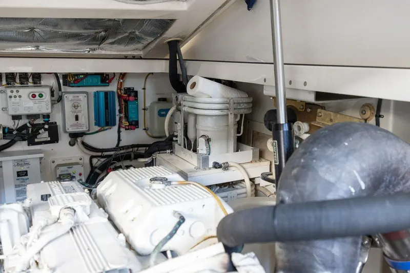 True Story Yacht Photos Pics Engine room of a 2012 Cabo 40 Hardtop Express, showcasing mechanical components and wiring.