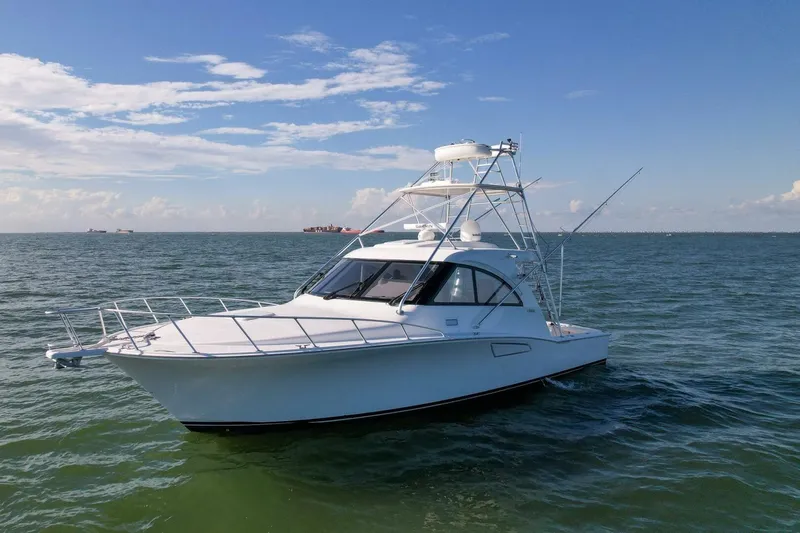 True Story Yacht Photos Pics 2012 Cabo 40 Hardtop Express boat on open water under clear blue sky.