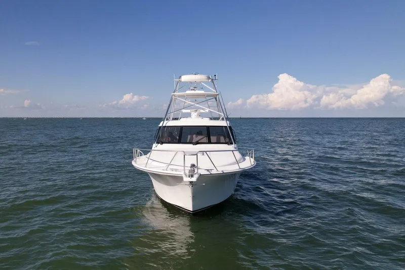 True Story Yacht Photos Pics 2012 Cabo 40 Hardtop Express boat on open sea under blue sky.