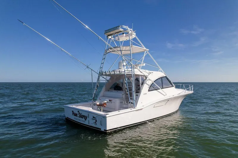 True Story Yacht Photos Pics 2012 Cabo 40 Hardtop Express boat on open water under clear blue sky.