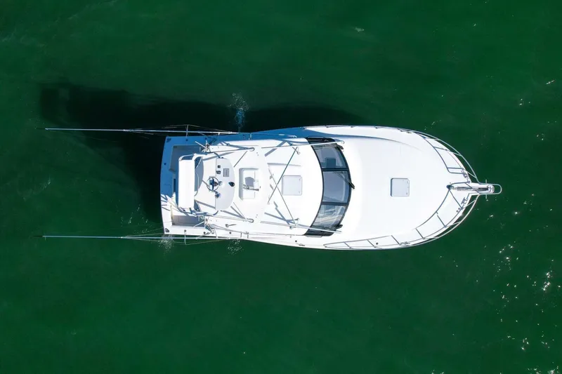 True Story Yacht Photos Pics Overhead view of 2012 Cabo 40 Hardtop Express boat on green water.