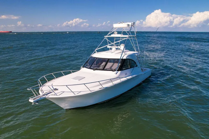 True Story Yacht Photos Pics 2012 Cabo 40 Hardtop Express yacht cruising on open sea under clear skies.