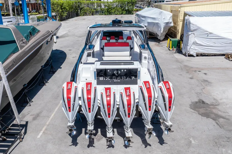  Yacht Photos Pics 2021 Cigarette 59 Tirranna boat with six powerful outboard engines, docked in a marina.