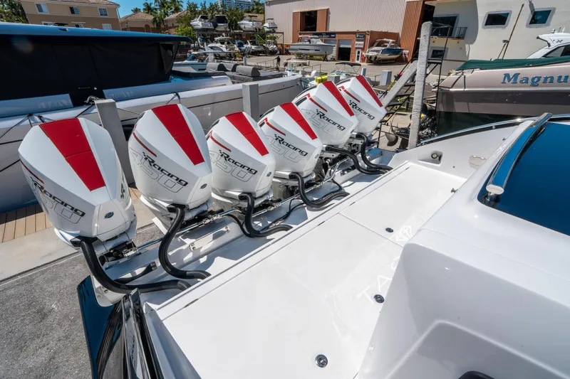  Yacht Photos Pics 2021 Cigarette 59 Tirranna boat with six powerful outboard engines docked at a marina.