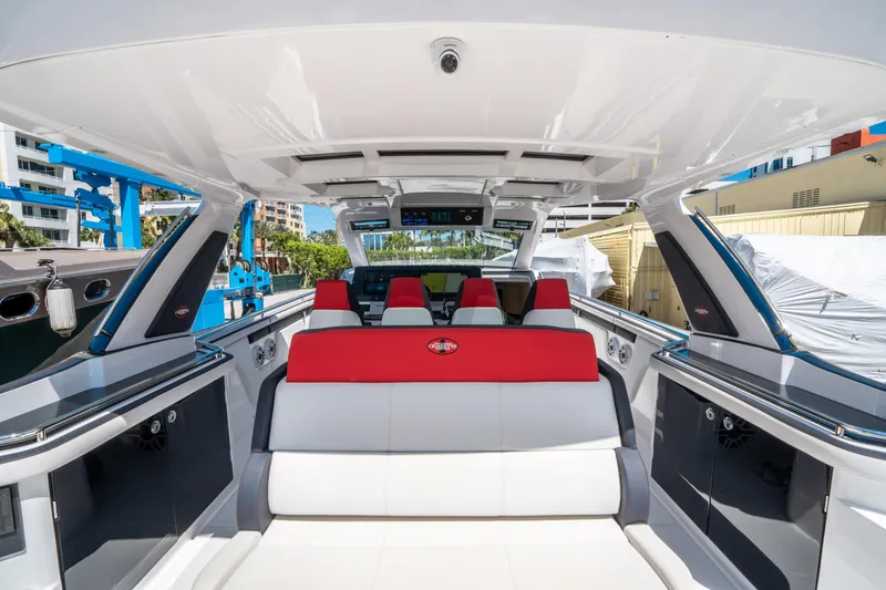  Yacht Photos Pics 2021 Cigarette 59 Tirranna luxury boat interior with red and white seating.