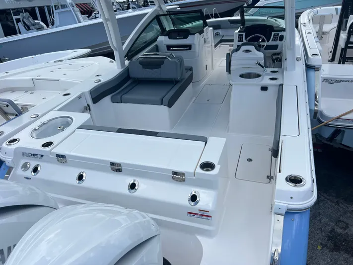  Yacht Photos Pics 2025 Robalo R257 Dual Console boat interior with seating and control panel.