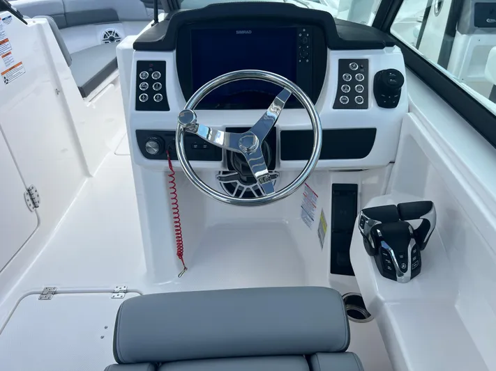  Yacht Photos Pics 2025 Robalo R257 Dual Console boat cockpit with modern steering and controls.