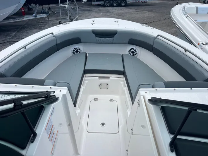  Yacht Photos Pics 2025 Robalo R257 Dual Console boat interior with gray seating and storage compartments.