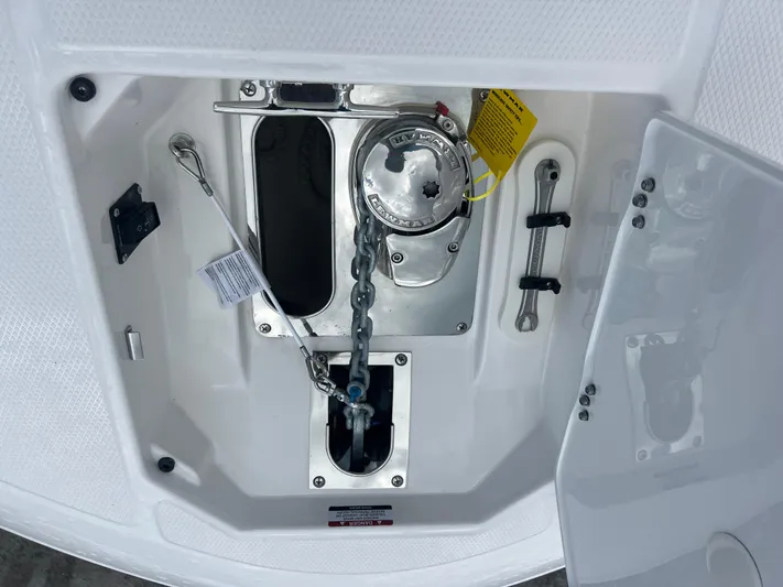  Yacht Photos Pics Anchor compartment of 2025 Robalo R257 Dual Console boat, featuring chain and storage.
