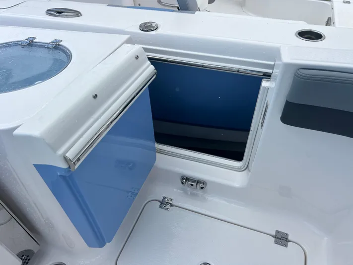  Yacht Photos Pics 2025 Robalo R257 Dual Console boat with open storage compartment and livewell.