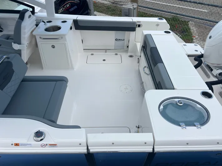 Yacht Photos Pics 2025 Robalo R257 Dual Console boat interior with seating and storage compartments.