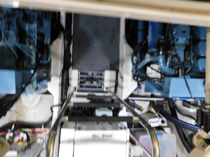 Sun Baked Yacht Photos Pics Engine room of a 1999 Tiara Yachts 3500 Express, showcasing mechanical components and equipment.