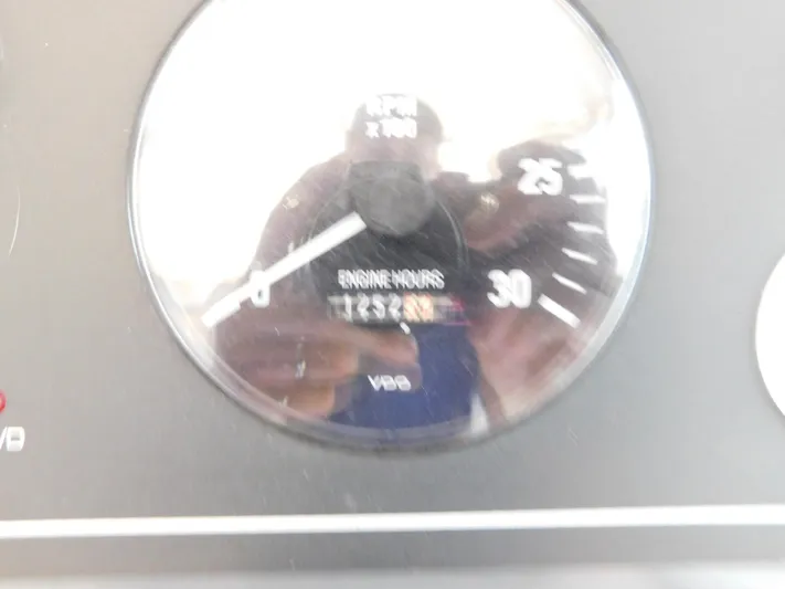 Sun Baked Yacht Photos Pics Close-up of Tiara Yachts 3500 Express 1999 engine hours gauge showing 1253.