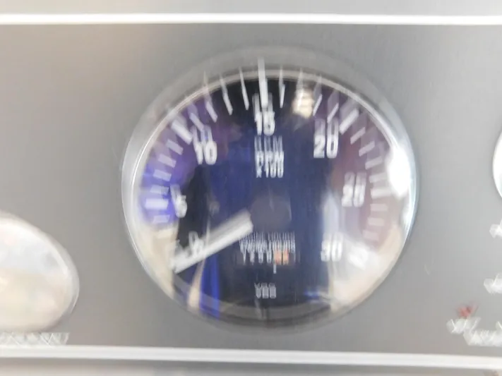 Sun Baked Yacht Photos Pics Blurry tachometer gauge on a 1999 Tiara Yachts 3500 Express dashboard.