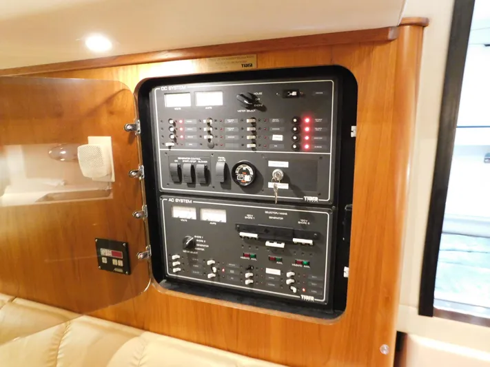 Sun Baked Yacht Photos Pics Electrical control panel on a 1999 Tiara Yachts 3500 Express boat.