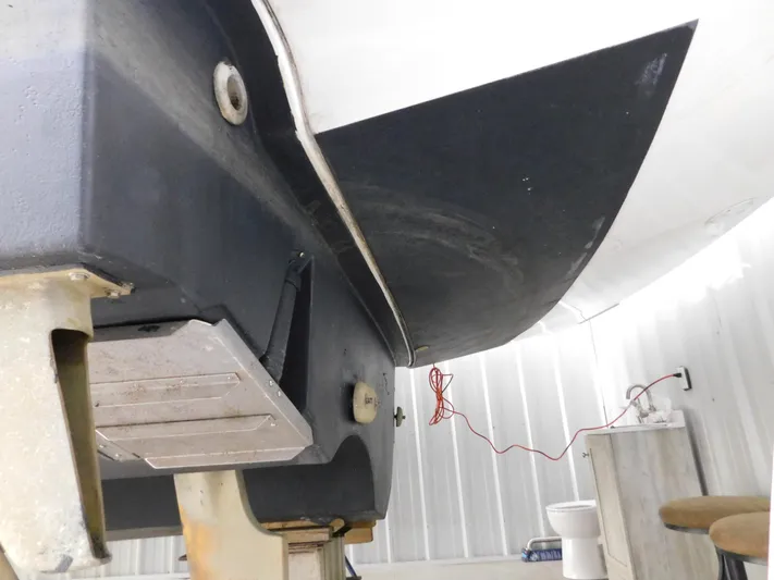 Sun Baked Yacht Photos Pics 1999 Tiara Yachts 3500 Express hull in storage, showcasing underside details.